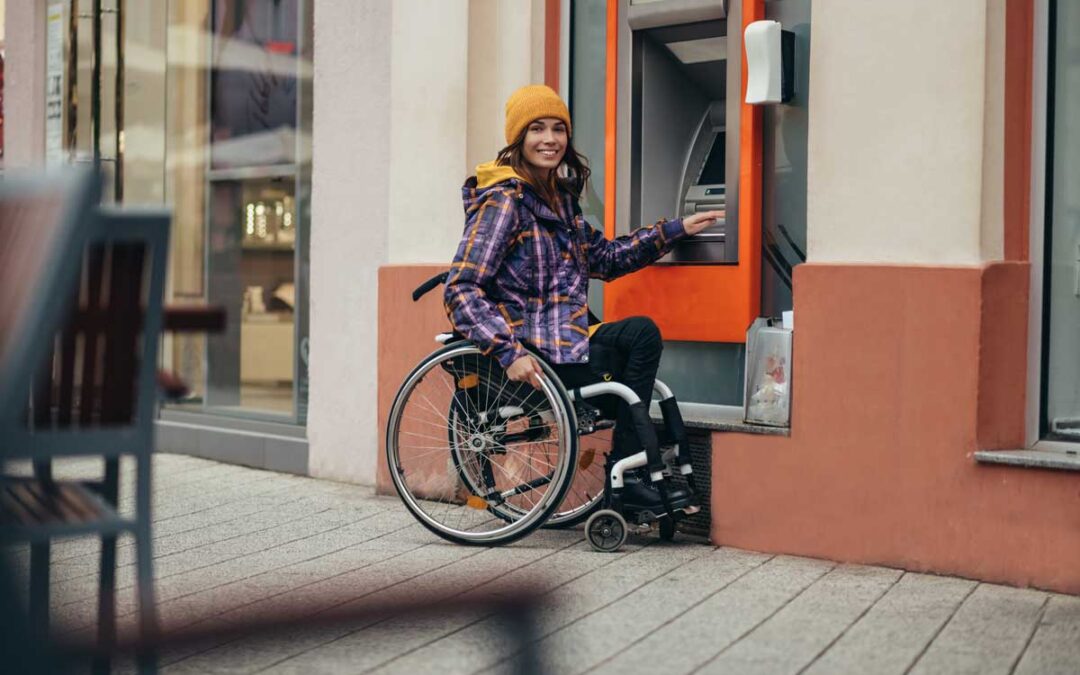 Woman in Wheelchair at an ATM in NET ATM Network