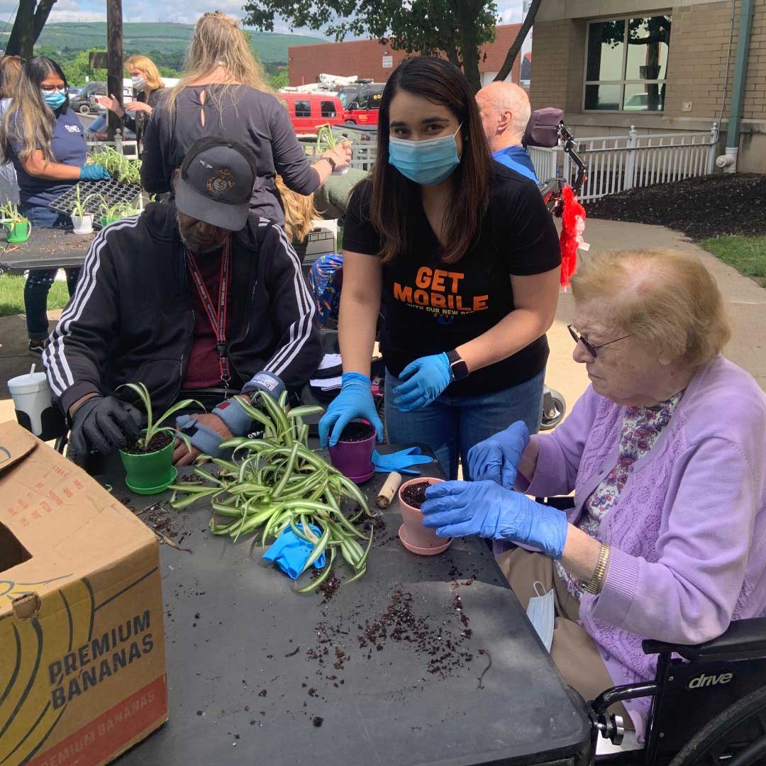 Jess H. planting flowers for Gino Merli Veterans Center #netcares